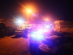 Police are seen outside a township pub in South Africa's southern city of East London.(AFP) Police are seen outside a township pub in South Africa's southern city of East London.(AFP)