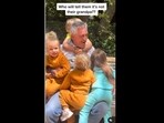 A screengrab of the video of toddlers hugging a man who they assumed was their grandfather. (annatwinsies/Instagram)