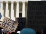 bortion rights activists hold signs during a protest in front of the Supreme Court building following the announcement to the Dobbs v Jackson Women's Health Organization ruling on June 25, 2022 in Washington, DC. (AFP) bortion rights activists hold signs during a protest in front of the Supreme Court building following the announcement to the Dobbs v Jackson Women's Health Organization ruling on June 25, 2022 in Washington, DC. (AFP)