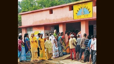 People wait in queues to cast votes at a polling station during bypoll to the Mandar assembly seat, Ranchi, June 23, 2022 (PTI)