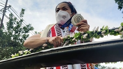 Mirabai Chanu being welcomed by people as she arrives at the airport in Imphal after winning the silver medal at Tokyo Olympics (ANI /File Photo) Mirabai Chanu being welcomed by people as she arrives at the airport in Imphal after winning the silver medal at Tokyo Olympics (ANI /File Photo)