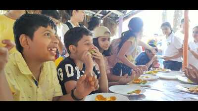 Children enjoying mangoes at the mango festival. (Sourced) Children enjoying mangoes at the mango festival. (Sourced)