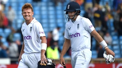 England's Ollie Pope, left, and England's Joe Root leave the field at the end of play on the fourth day of the third cricket test match between England and New Zealand at Headingley in Leeds (AP) England's Ollie Pope, left, and England's Joe Root leave the field at the end of play on the fourth day of the third cricket test match between England and New Zealand at Headingley in Leeds (AP)
