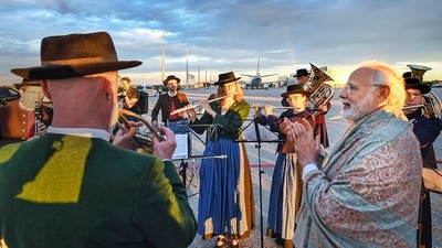 PM Modi landed in Germany to a welcome music by the Bavarian band. (PTI) PM Modi landed in Germany to a welcome music by the Bavarian band. (PTI)
