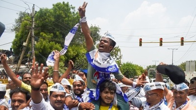 AAP workers celebrate after party candidate Durgesh Pathak won Rajinder Nagar by-elections, in New Delhi. (PTI) AAP workers celebrate after party candidate Durgesh Pathak won Rajinder Nagar by-elections, in New Delhi. (PTI)