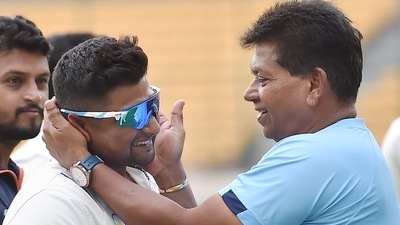 Madhya Pradesh's coach Chandrakant Pandit greets Mumbai's Sarfaraz Khan (PTI) Madhya Pradesh's coach Chandrakant Pandit greets Mumbai's Sarfaraz Khan (PTI)