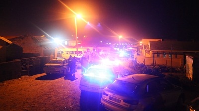 Police are seen outside a township pub in South Africa's southern city of East London. (AFP)