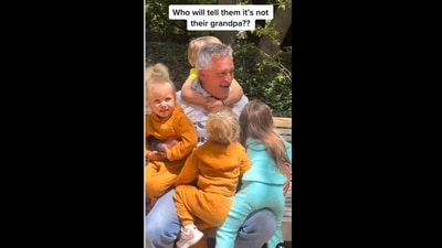 A screengrab of the video of toddlers hugging a man who they assumed was their grandfather.&nbsp; (annatwinsies/Instagram)