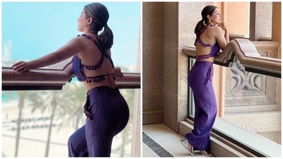 Hina paired the blouse with a matching pair of purple-coloured pants, creating a monotone fashion moment. The bottoms come with silver pinstriped patterns, high-rise waistline, flared hem and side pockets embroidered with purple tassels. (Instagram) Hina paired the blouse with a matching pair of purple-coloured pants, creating a monotone fashion moment. The bottoms come with silver pinstriped patterns, high-rise waistline, flared hem and side pockets embroidered with purple tassels. (Instagram)