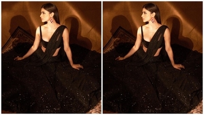 Mouni teamed the blouse with the lehenga skirt decked with shimmering silver sequins and featuring a heavy layered A-line ghera. A net dupatta embellished with vertical lined sequins, draped over the body and shoulder, completed the outfit. (Instagram) Mouni teamed the blouse with the lehenga skirt decked with shimmering silver sequins and featuring a heavy layered A-line ghera. A net dupatta embellished with vertical lined sequins, draped over the body and shoulder, completed the outfit. (Instagram)