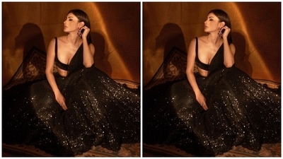 Mouni turned muse for Indian fashion designer Sawan Gandhi for the photoshoot. She picked a sequinned lehenga and short choli set with a net dupatta from his label and looked exquisite as always. (Instagram) Mouni turned muse for Indian fashion designer Sawan Gandhi for the photoshoot. She picked a sequinned lehenga and short choli set with a net dupatta from his label and looked exquisite as always. (Instagram)
