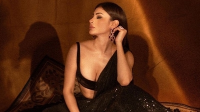 Lehengas have always been a celebrity favourite when it comes to traditional fashion. And one star who loves wearing this classic silhouette is Mouni Roy. A look at the Brahmastra actor's past sartorial choices, and you will know. She has served several stunning fashion moments for her fans in the evergreen style statement, and now, she has another new look to share. It will definitely swoop you off your feet. Scroll ahead to check out the photos. (Instagram) Lehengas have always been a celebrity favourite when it comes to traditional fashion. And one star who loves wearing this classic silhouette is Mouni Roy. A look at the Brahmastra actor's past sartorial choices, and you will know. She has served several stunning fashion moments for her fans in the evergreen style statement, and now, she has another new look to share. It will definitely swoop you off your feet. Scroll ahead to check out the photos. (Instagram)