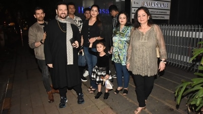 Neil Nitin Mukesh was spotted with his entire family on a dinner outing on Saturday. He posed for the paparazzi with his wife Rukmini, daughter Nurvi, father Nitin Mukesh and mother Nishi. (Varinder Chawla)&nbsp; 