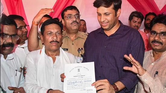 BJP candidate Ghanshyam Lodhi receives his election certificate after winning the Rampur Lok Sabha seat on Sunday. (PTI PHOTO)