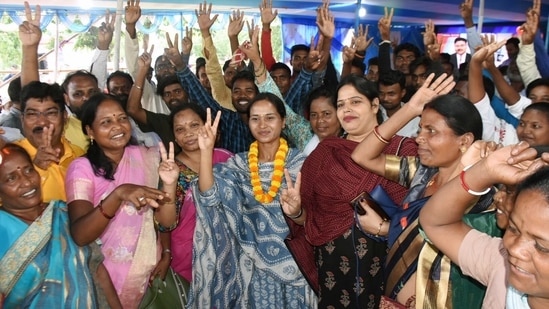 Congress Candidate Shilpi Neha Tirkey and supporters show victory signs as she wins the bi-election from Mandar Constituency, in Ranchi.(Somanth Sen)