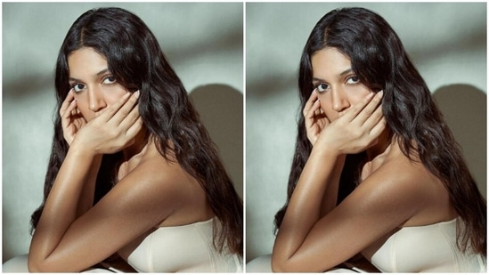 In a indoor photoshoot, Bhumi sat and posed in the gorgeous white attire.(Instagram/@bhumipednekar)