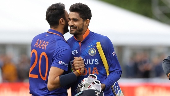 Axar Patel and Deepak Hooda celebrate India's win in the 1stT20I against Ireland at Malahide Cricket Club in Dublin on June 26, 2022.(AFP)