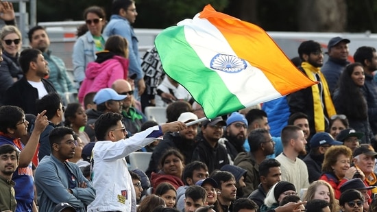 An India supporter waves a flag in the crowd during the 1st T20I match between Ireland and India at Malahide Cricket Club in Dublin on June 26, 2022.(AFP)