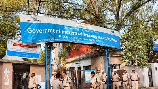 Security personnel deployed outside the counting centre in Delhi.