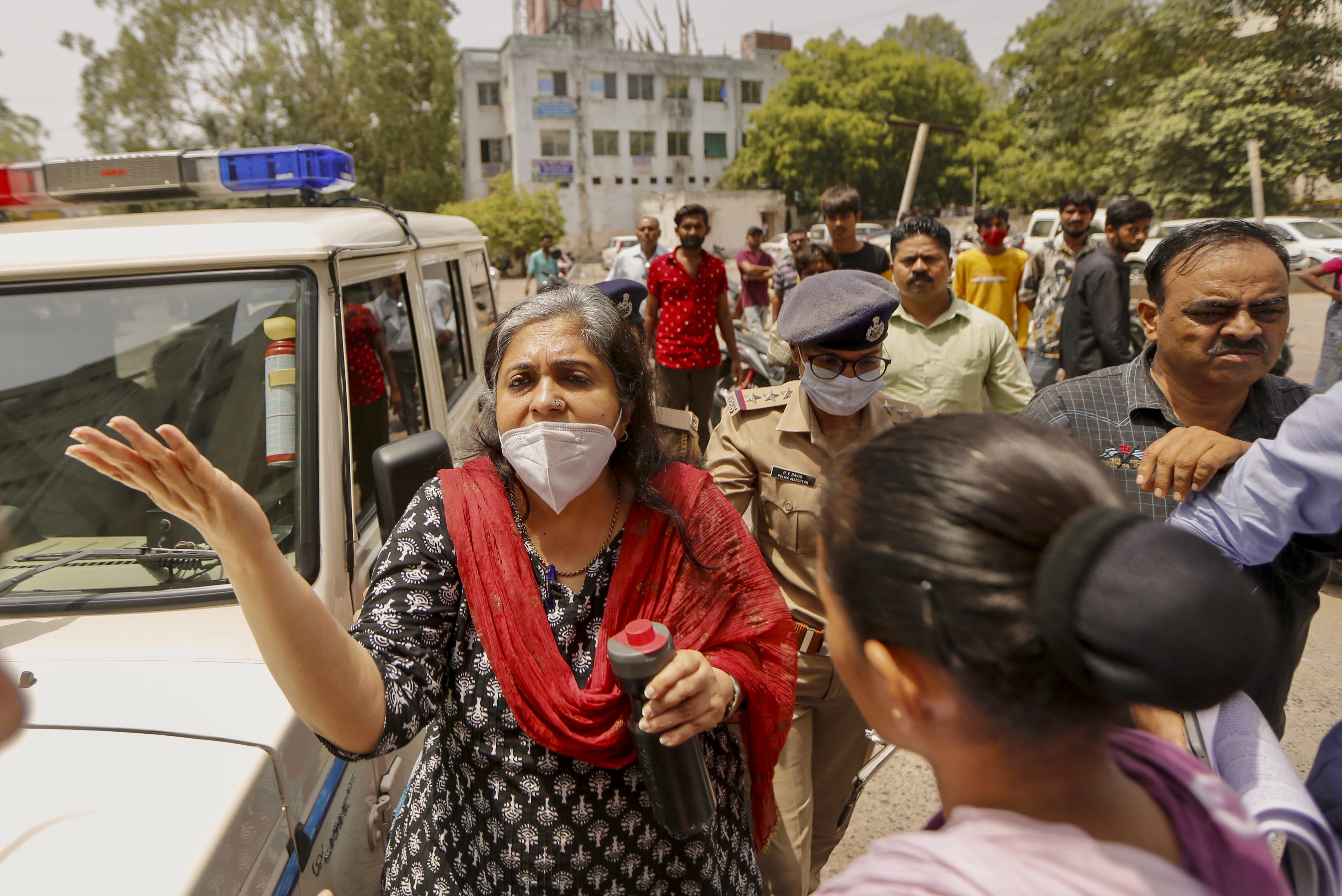 Crime branch officials produce social activist Teesta Setalvad at the Metropolitan Magistrate Court in Ahmedabad, Sunday. (PTI) Crime branch officials produce social activist Teesta Setalvad at the Metropolitan Magistrate Court in Ahmedabad, Sunday. (PTI)