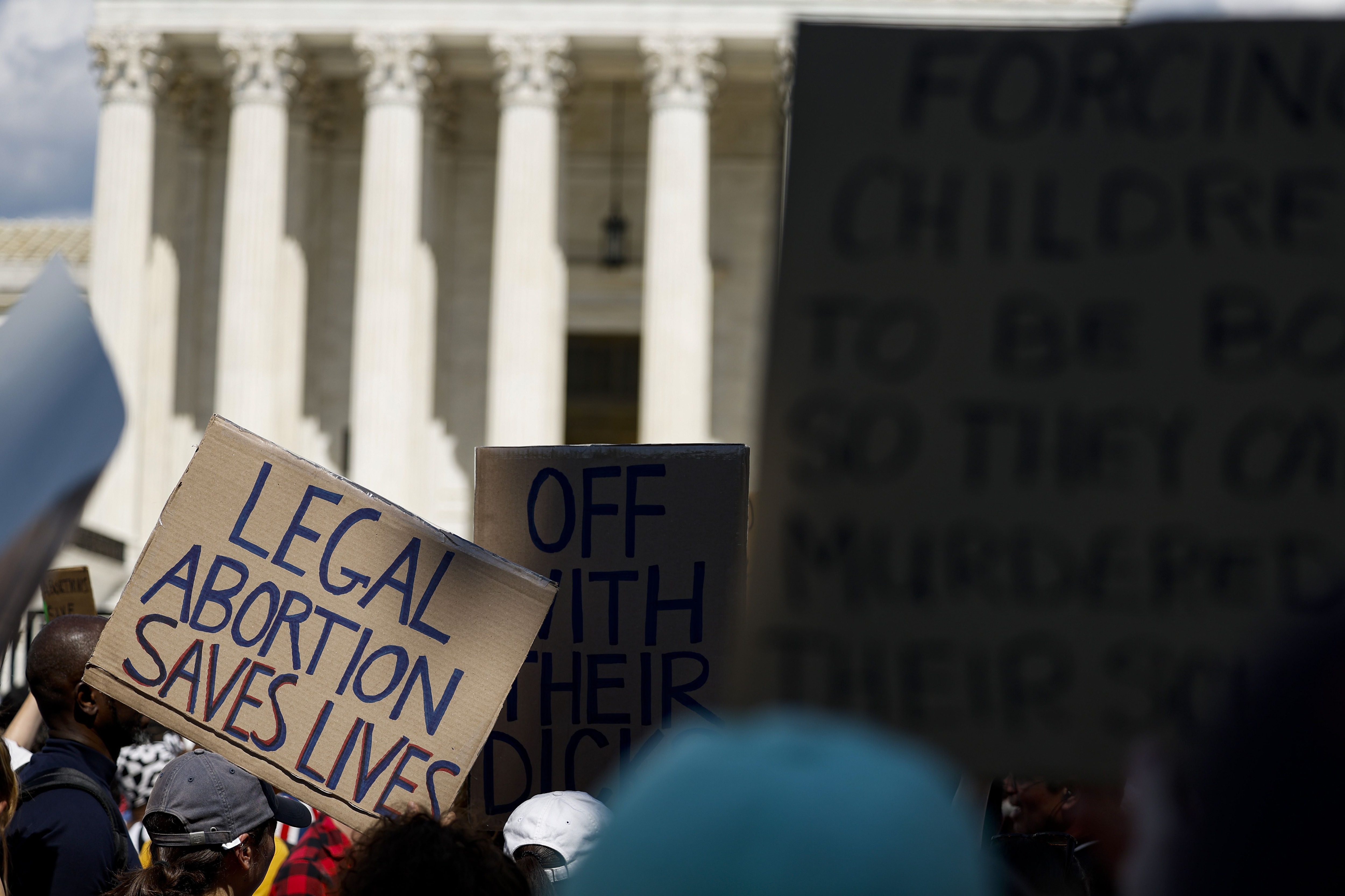 bortion rights activists hold signs during a protest in front of the Supreme Court building following the announcement to the Dobbs v Jackson Women's Health Organization ruling on June 25, 2022 in Washington, DC. (AFP) bortion rights activists hold signs during a protest in front of the Supreme Court building following the announcement to the Dobbs v Jackson Women's Health Organization ruling on June 25, 2022 in Washington, DC. (AFP)