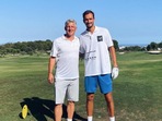 Daniil Medvedev and Bastian Schweinsteiger pose for a photo together.