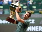 Poland's Hubert Hurkacz celebrates with the trophy after winning his singles final match against Russia's Daniil Medvedev at the ATP 500 Halle Open Poland's Hubert Hurkacz celebrates with the trophy after winning his singles final match against Russia's Daniil Medvedev at the ATP 500 Halle Open