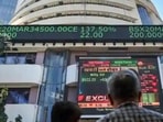 People watch the Sensex on a screen outside Bombay Stock Exchange (BSE) in Mumbai. (PTI File Photo) People watch the Sensex on a screen outside Bombay Stock Exchange (BSE) in Mumbai. (PTI File Photo)