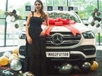 Nikki Tamboli poses with her new car.