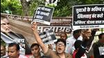 Congress workers raise slogans during the party's 'Satyagraha' against the 'Agnipath' scheme in New Delhi on Monday. (PTI Photo) Congress workers raise slogans during the party's 'Satyagraha' against the 'Agnipath' scheme in New Delhi on Monday. (PTI Photo)