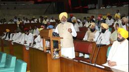 Punjab finance minister Harpal Singh Cheema presenting the first budget of the Aam Aadmi Party government in the state as chief minister Bhagwant Mann looks on in the assembly on Monday. (Ravi Kumar/HT)