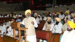 Punajb finance minister Harpak Singh Cheema presenting budget in state assembly. CM Bhagwant Mann is also seen. (HT Photos)