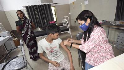 A health worker administers a dose of Covid-19 vaccine to a boy at a community health centre in Dasna, Ghaziabad. (Sakib Ali/ HT) A health worker administers a dose of Covid-19 vaccine to a boy at a community health centre in Dasna, Ghaziabad. (Sakib Ali/ HT)