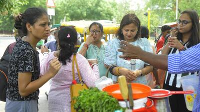 Visitors at the Rock Garden, Chandigarh, cooling down with lemonade. (Keshav Singh/HT)