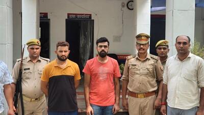 Ravi Thakkar (third from left) in custody on Monday. (Sourced)
