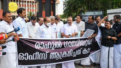 Opposition MLAs stage a protest outside the Kerala Assembly after boycotting the proceedings against an attack on the regional office of Congress MP Rahul Gandhi in Thiruvananthapuram on Monday. (PTI PHOTO.)