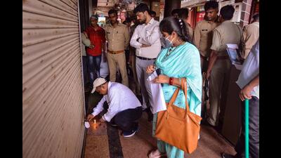 An officer seals the ‘Baba Biryani’ restaurant of Mukhtar Baba, the main accused of Kanpur violence case, in Kanpur, Monday. (PTI Photo)