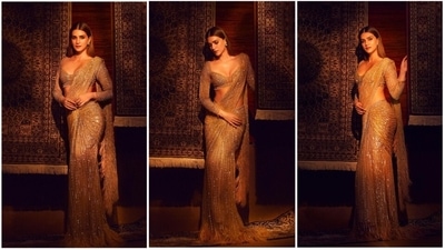 Kriti Sanon, known for her fitness regime and versatile performances in films, is also a big time fashion enthusiasts with an amazing style sense. Her wardrobe is something all fashionistas eye on. Recently, she made heads turn in an embellished couture saree. (Instagram/@kritisanon) Kriti Sanon, known for her fitness regime and versatile performances in films, is also a big time fashion enthusiasts with an amazing style sense. Her wardrobe is something all fashionistas eye on. Recently, she made heads turn in an embellished couture saree. (Instagram/@kritisanon)