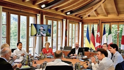 Ukraine’s President Volodymyr Zelensky (on screen) addresses G7 leaders and representatives of the European Union during their working session at Elmau Castle, Germany, on Monday. (Reuters) Ukraine’s President Volodymyr Zelensky (on screen) addresses G7 leaders and representatives of the European Union during their working session at Elmau Castle, Germany, on Monday. (Reuters)