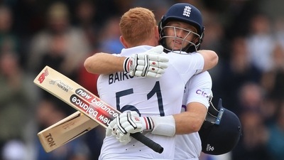 England's Jonny Bairstow and Joe Root celebrate their win on day 5 of the third cricket Test match vs New Zealand at Headingley Cricket Ground in Leeds. (AFP)