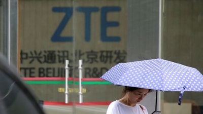 A woman stands outside a building of ZTE Beijing research and development center in Beijing, China. (REUTERS)