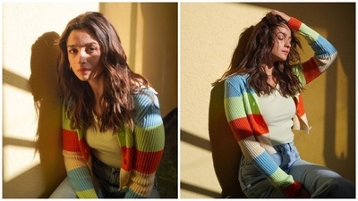 Alia served winter casual wardrobe inspiration with this look. The actor donned a ribbed multi-coloured cardigan over a striped top and high-waisted denim jeans set. She styled the uber-cool outfit with her signature no-makeup look and hoop earrings. (Instagram) Alia served winter casual wardrobe inspiration with this look. The actor donned a ribbed multi-coloured cardigan over a striped top and high-waisted denim jeans set. She styled the uber-cool outfit with her signature no-makeup look and hoop earrings. (Instagram)