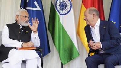 German Chancellor Olaf Scholz in conversation with Prime Minister Narendra Modi during a meeting on the sidelines of the G7 Summit at Castle Elmau in Kruen, near Garmisch-Partenkirchen in Germany on Monday. (AP PHOTO.) German Chancellor Olaf Scholz in conversation with Prime Minister Narendra Modi during a meeting on the sidelines of the G7 Summit at Castle Elmau in Kruen, near Garmisch-Partenkirchen in Germany on Monday. (AP PHOTO.)