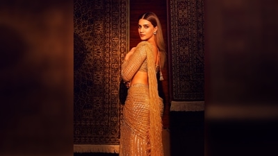 Kriti Sanon teamed her look with a matching blouse featuring a plunging neckline. (Instagram/@kritisanon) Kriti Sanon teamed her look with a matching blouse featuring a plunging neckline. (Instagram/@kritisanon)