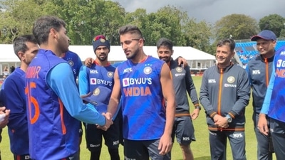 Umran Malik being handed his India cap by Bhuvneshwar Kumar (Twitter) Umran Malik being handed his India cap by Bhuvneshwar Kumar (Twitter)