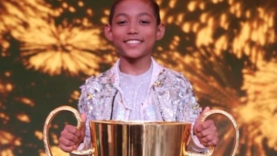 Nobojit Narzary poses with his winner's trophy on the Dance India Dance Lil Masters' stage.