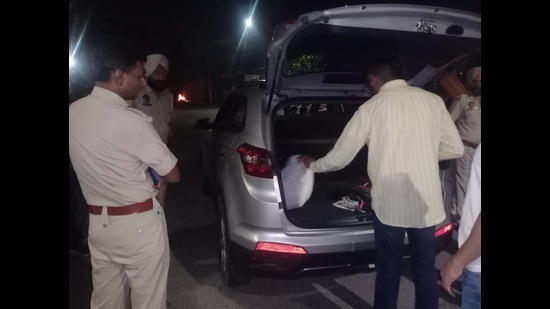 Police commissioner Kaustubh Sharma checking a vehicle in Ludhiana during the inspection. (Harvinder Singh/HT)