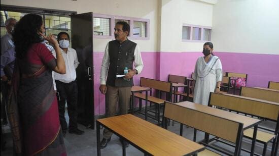 UT adviser Dharam Pal along with senior officers visiting Government High School, Hallomajra, in Chandigarh on Monday. (Keshav Singh/HT)