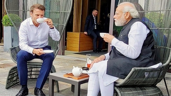 PM Modi and French President Emmanuel Macron hold a conversation, in Schloss Elmau.(ANI)