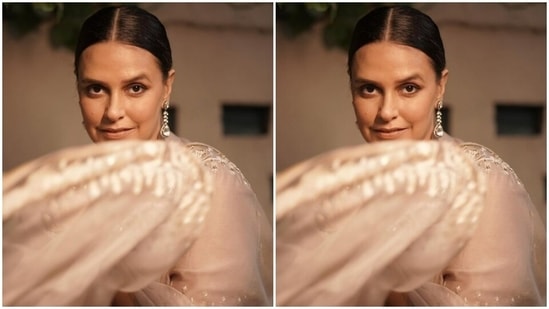 Styled by fashion stylist Ayesha Khanna, Neha wore her tresses into a clean bun with a middle part and decked up in nude eyeshadow, conrtoured cheeks and a shade of nude lipstick.(Instagram/@nehadhupia)
